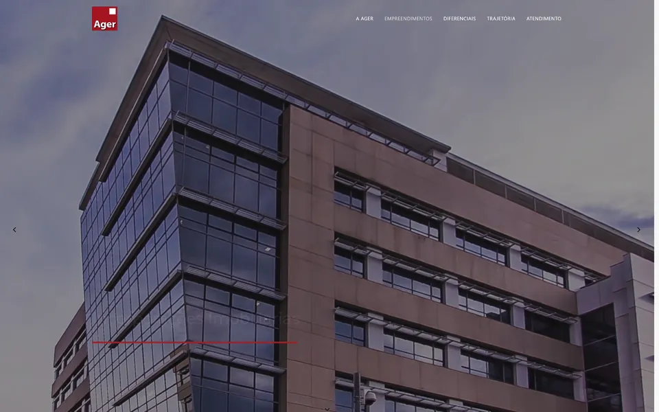 Agerimoveis landing page: a glass office tower photographed from below.