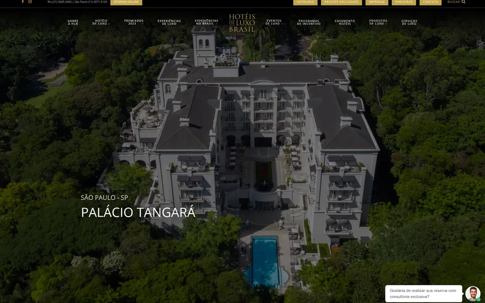 Hotéis de Luxo Brasil home page: an aerial view of a palace hotel surrounded by forest.