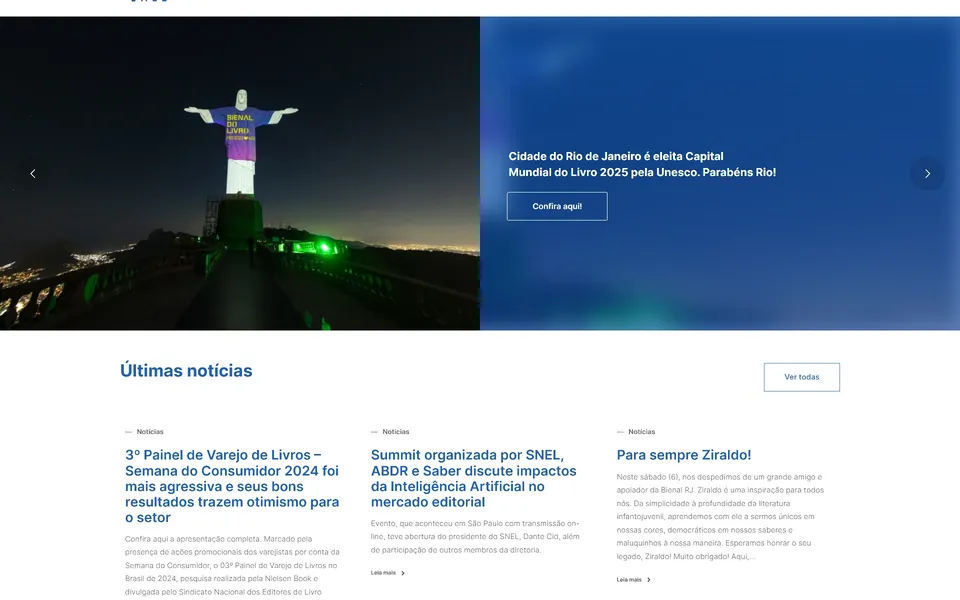 SNEL home page: Christ the Redeemer lit at night above a news listing.