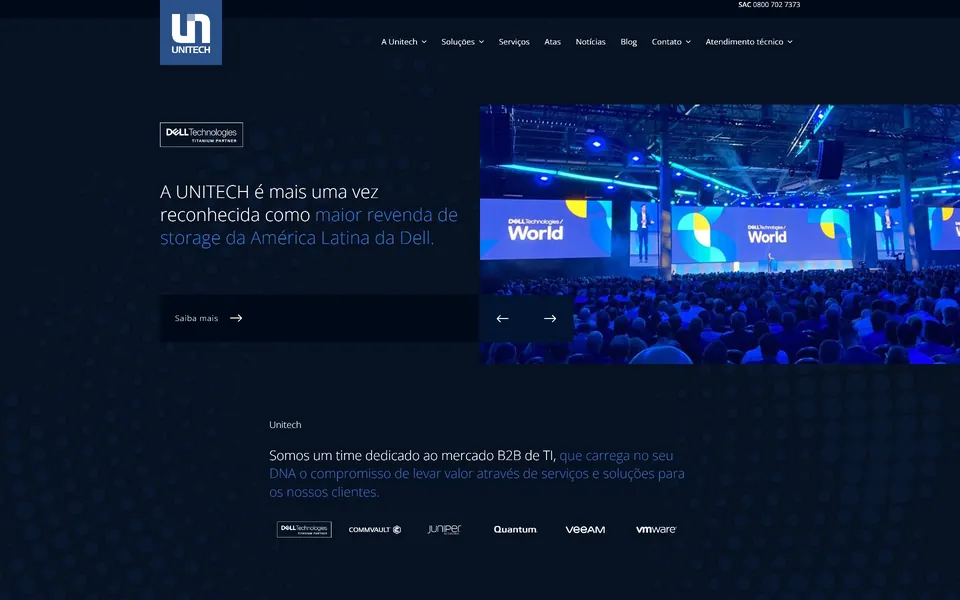 Unitech home page: dark navy layout with a large event stage photo.