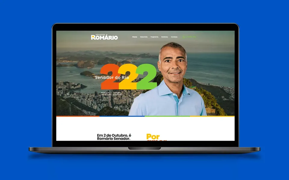 Romário 222 campaign home page on a laptop over a blue background, with the candidate and the number 222.